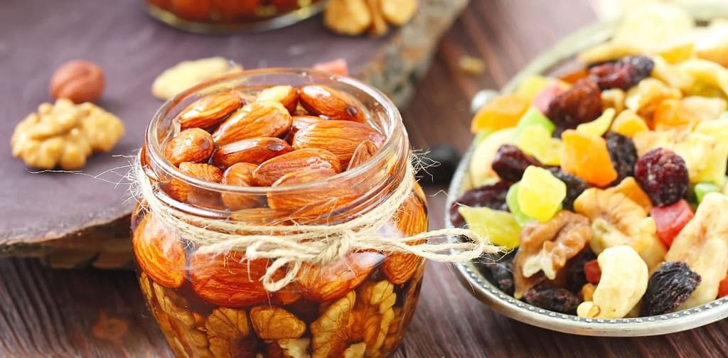 nuts in honey in a jar